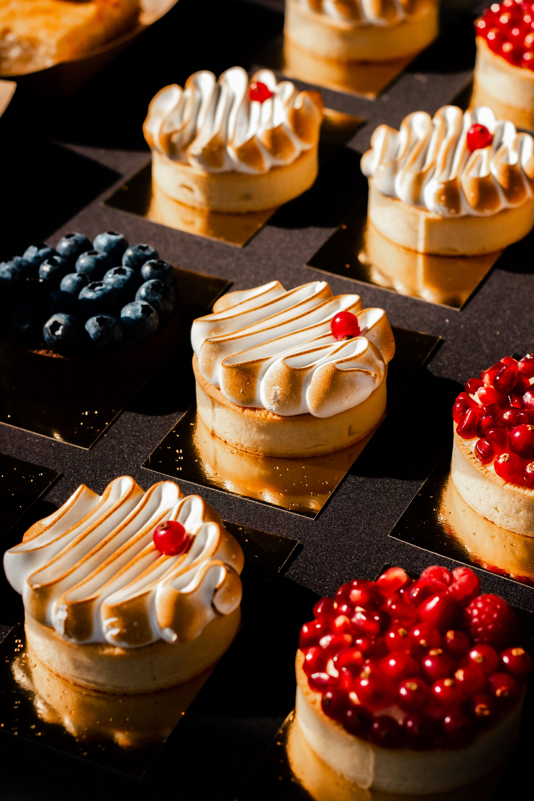 close up of different tart pastries with differ utc